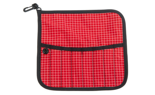 The front of a Tool Pen Wrap in Iberian (red with white grid) 200 Halcyon.